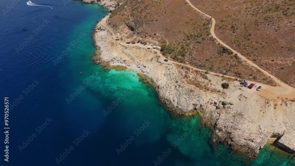 A hidden beach in albania with clear turquoise water and a rocky coastline, aerial view A hidden beach in albania with clear turquoise water and a rocky coastline, aerial view
