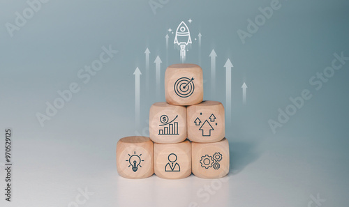 Rocket launching from wood cube with business icon, Start-up, Creativity, Big idea, Business goals management, Investment on new project to wealth, Company strategy target, Sustainable financial plan