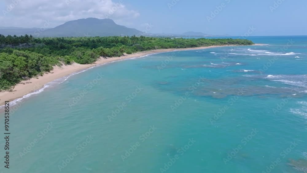 Fast bird's eye view of Bergantin Beach overlooking crystal turquoise waters in the Caribbean, Dominican Republic. Fast bird's eye view of Bergantin Beach overlooking crystal turquoise waters in the Caribbean, Dominican Republic.