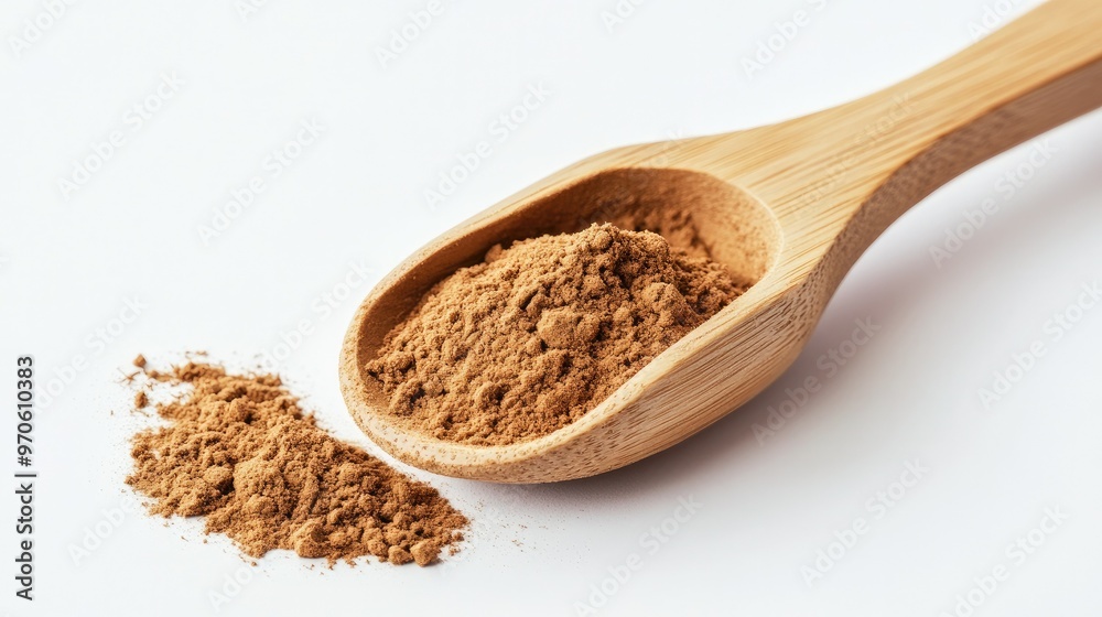 A bamboo scoop holding hojicha powder resting on a white backdrop, highlighting its smooth texture and roasted color A bamboo scoop holding hojicha powder resting on a white backdrop, highlighting its smooth texture and roasted color