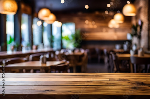 photo wooden table and blurred background of outdoor restaurant with bokeh light 