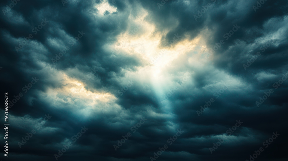 Dark clouds with sun breaking through create dramatic and moody atmosphere, evoking sense of awe and wonder in sky Dark clouds with sun breaking through create dramatic and moody atmosphere, evoking sense of awe and wonder in sky