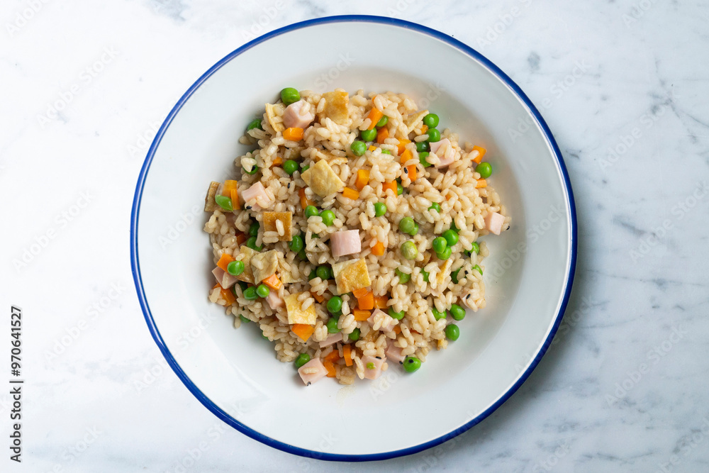 Brown rice with vegetables and turkey cubes. Top view. Brown rice with vegetables and turkey cubes. Top view.