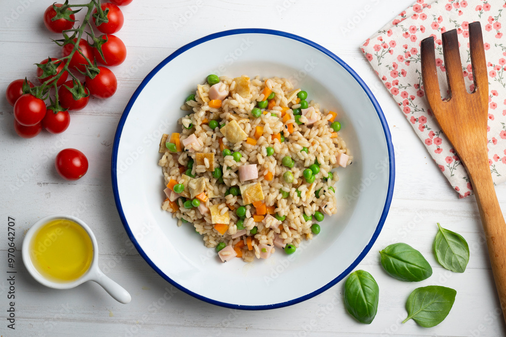 Brown rice with vegetables and turkey cubes. Top view.