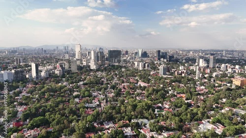 Soaring above outhern reaches of Mexico City on a scorching summer day photo