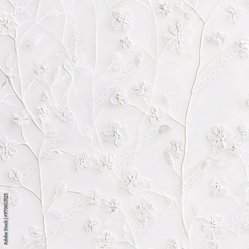 Delicate white embossed floral pattern with slender branches on soft background