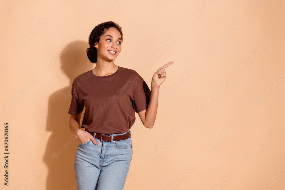 Photo of lovely cheerful woman wear stylish clothes recommend banner look empty space isolated on beige color background Photo of lovely cheerful woman wear stylish clothes recommend banner look empty space isolated on beige color background