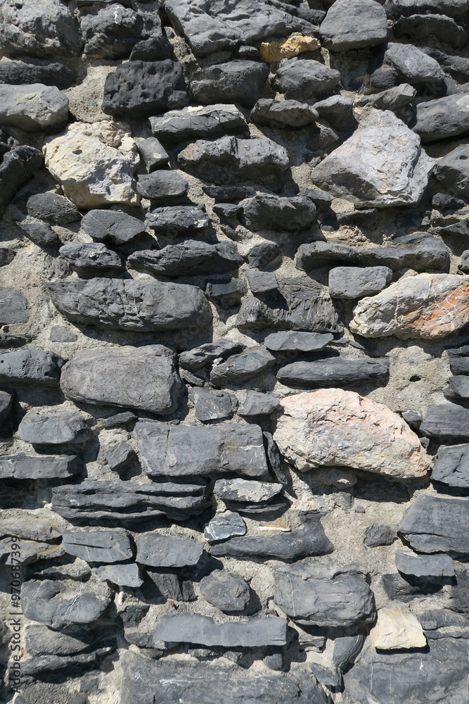 Grey stone rock wall with random pattern Grey stone rock wall with random pattern