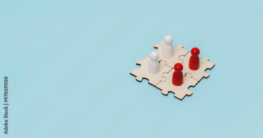 A wooden dolls standing on jigsaw puzzle to business connect concept. Business solutions, success and strategy. Trade and exchange in business ventures
