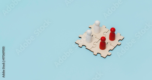 Obraz na płótnie A wooden dolls standing on jigsaw puzzle to business connect concept. Business solutions, success and strategy. Trade and exchange in business ventures w salonie