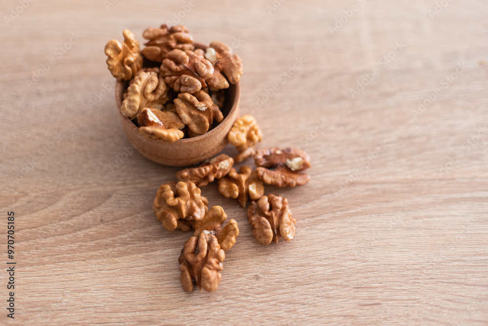 Peeled walnuts. On a wooden board. Healthy food. Natural background. Peeled walnuts. On a wooden board. Healthy food. Natural background.