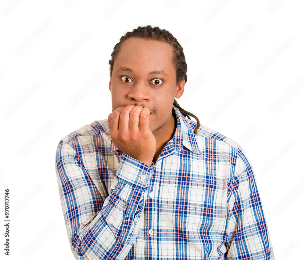 portrait of a young shy unhappy guy biting his nails, craving for something feeling anxious and worried portrait of a young shy unhappy guy biting his nails, craving for something feeling anxious and worried
