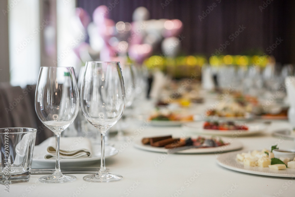 served table, glasses, plates, vase with forge served table, glasses, plates, vase with forge