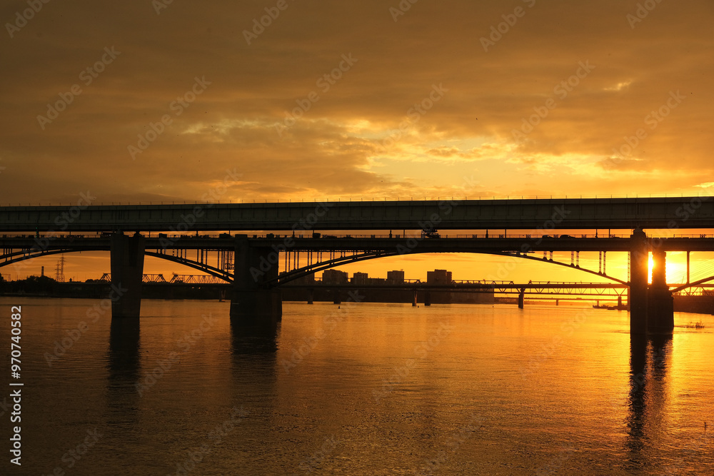 bridge at sunset, Novosibirsk bridge over the Ob river. bridge at sunset, Novosibirsk bridge over the Ob river.