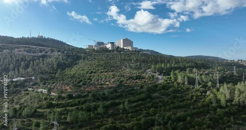 Aerial footage of the Hadassah Ein Karem hospital in Jerusalem located between mountains and amazing landscapes.
