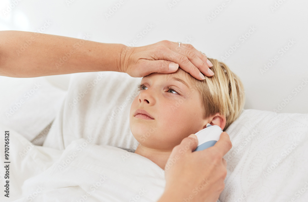 Hand, fever and child on bed, temperature and person with daughter, sick or touch on forehead in house. Bedroom, family and measure for flu with tympanic thermometer, ear and test of sickness or care Hand, fever and child on bed, temperature and person with daughter, sick or touch on forehead in house. Bedroom, family and measure for flu with tympanic thermometer, ear and test of sickness or care