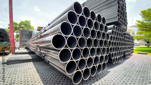Construction products on transport vehicles Group of steel pipes for industrial materials Construction engineering products  equipment, steel pipes, metal warehouse industry, delivery to customers