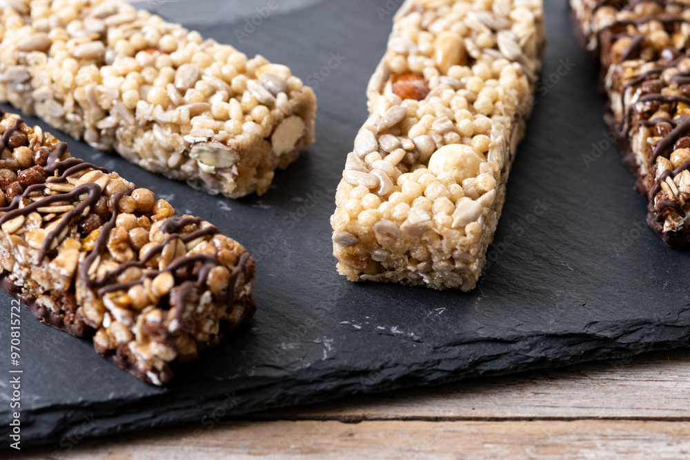 Healthy Muesli bar with nuts and seeds on wooden table Healthy Muesli bar with nuts and seeds on wooden table
