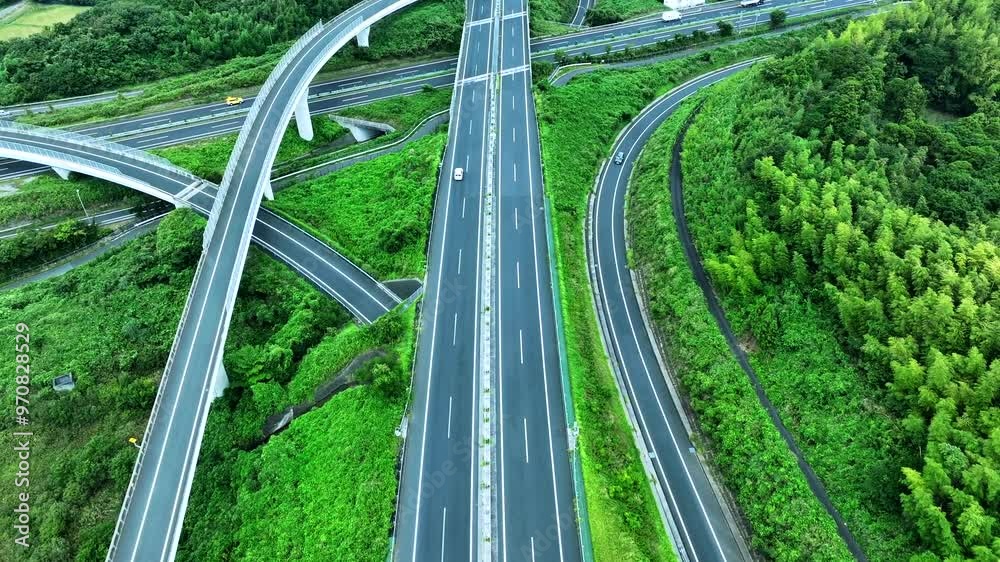Aerial view of a highway crossing greenery Aerial view of a highway crossing greenery