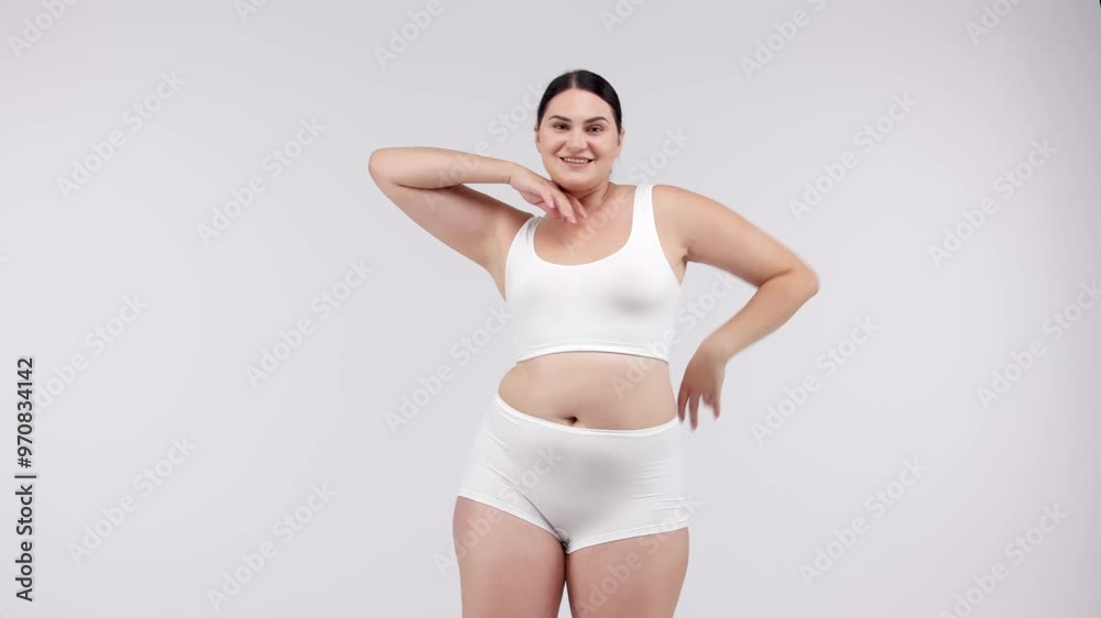 Woman measuring her body with a tape measure on a light background. Perfect for promoting weight loss programs and fitness results, inspiring a healthy lifestyle. Woman measuring her body with a tape measure on a light background. Perfect for promoting weight loss programs and fitness results, inspiring a healthy lifestyle.