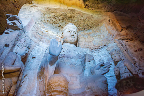 Giant Buddha statue at Yungang Grottoes in Datong, Shanxi photo