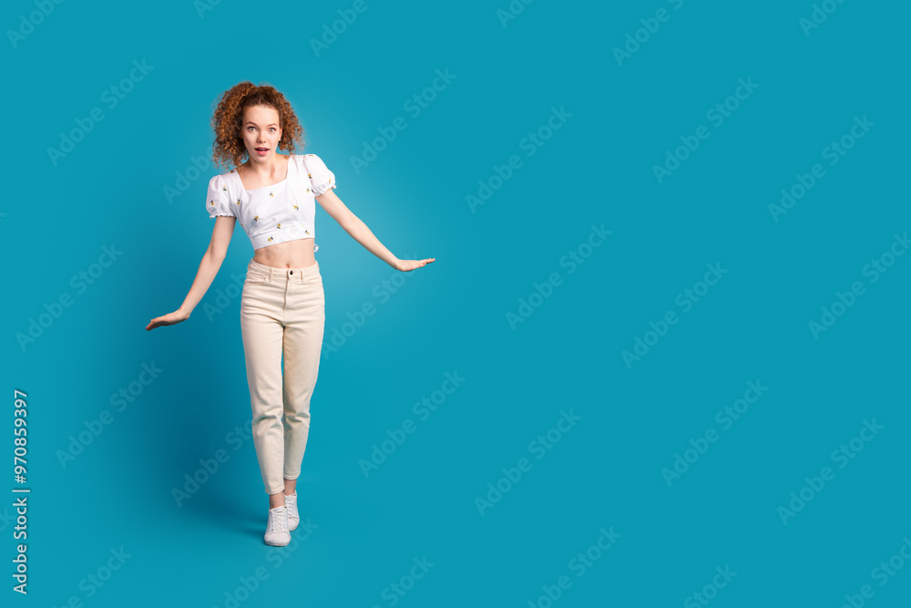 Full length photo of lovely young lady keep balance amazed tightrope dressed stylish white garment isolated on blue color background Full length photo of lovely young lady keep balance amazed tightrope dressed stylish white garment isolated on blue color background