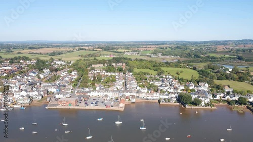 Aerial view of Topsham, Devon, highlights the River Exe and town. Captures the vibrant community, scenic riverside, and urban charm. Perfect for travel and cultural documentaries. photo