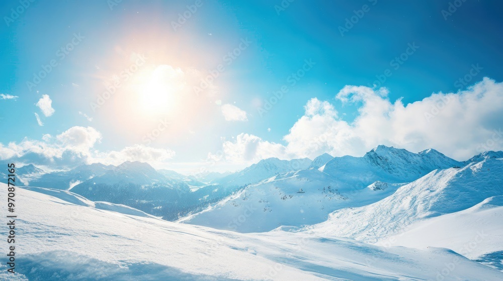 A snow-covered mountain range glowing under a bright winter sun, perfect for a serene winter escape. A snow-covered mountain range glowing under a bright winter sun, perfect for a serene winter escape.