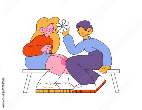 Man puts flower in woman's hair 