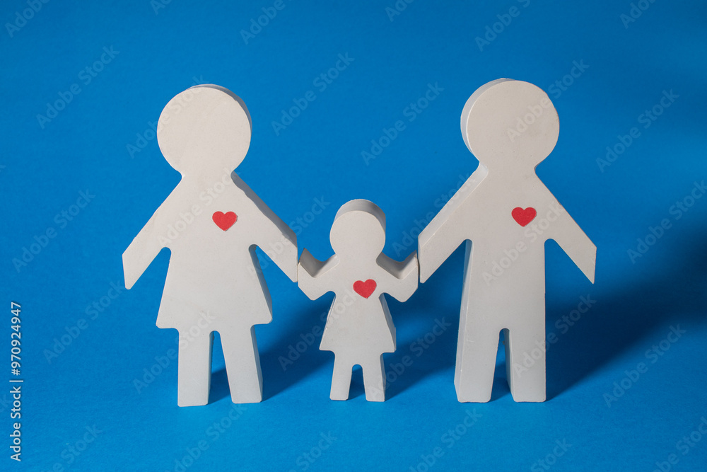 Family model on blue background. Gypsum figures. Family model on blue background. Gypsum figures.