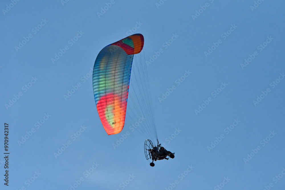 A hang glider pilot in the air