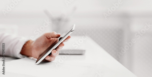 Social Media Concept. Closeup of woman hands with mobile, blogger using smartphone, panorama