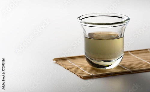 Alcohol in a shot glass on a white background