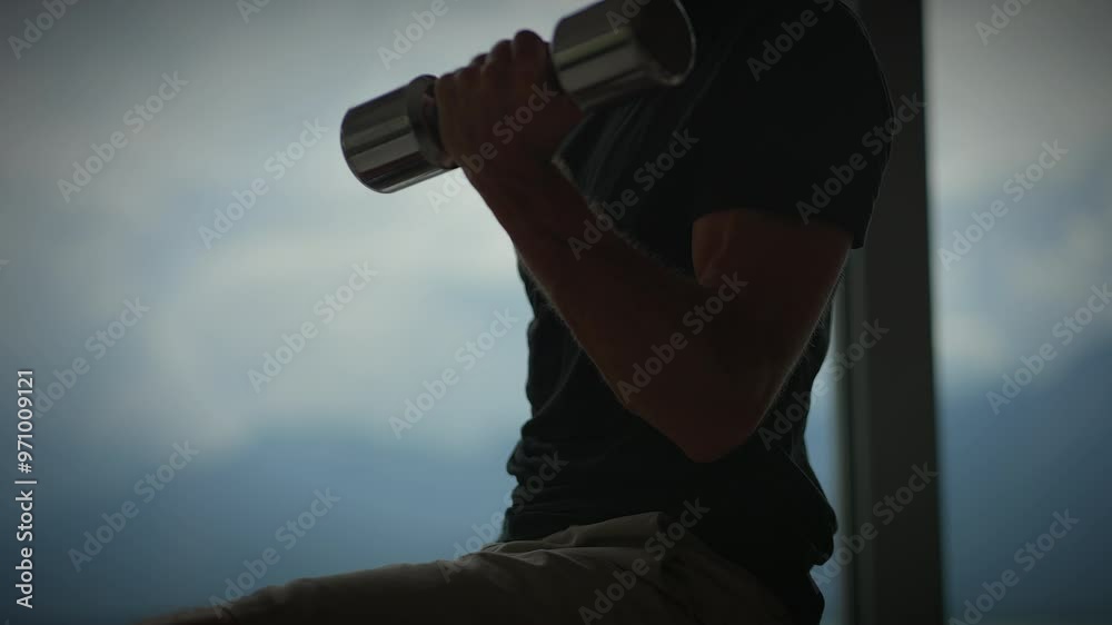 A CloseUp of a Person Lifting Weights in a Modern and WellEquipped Gym Environment A CloseUp of a Person Lifting Weights in a Modern and WellEquipped Gym Environment
