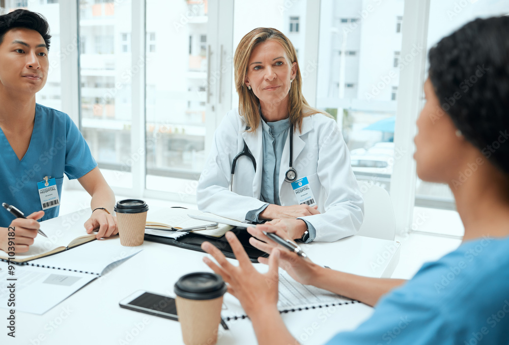 Doctor, review and medical students with talking as group for healthcare, meeting or feedback. People, technology and diversity in discussion in teamwork as staff for internship in clinic or hospital Doctor, review and medical students with talking as group for healthcare, meeting or feedback. People, technology and diversity in discussion in teamwork as staff for internship in clinic or hospital