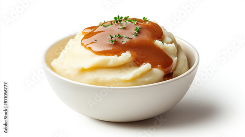 A bowl of mashed potatoes with gravy on top photo