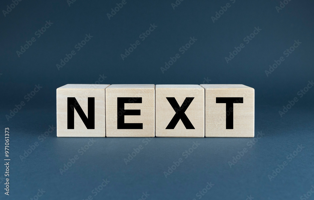 Wooden blocks spelling out the word next
