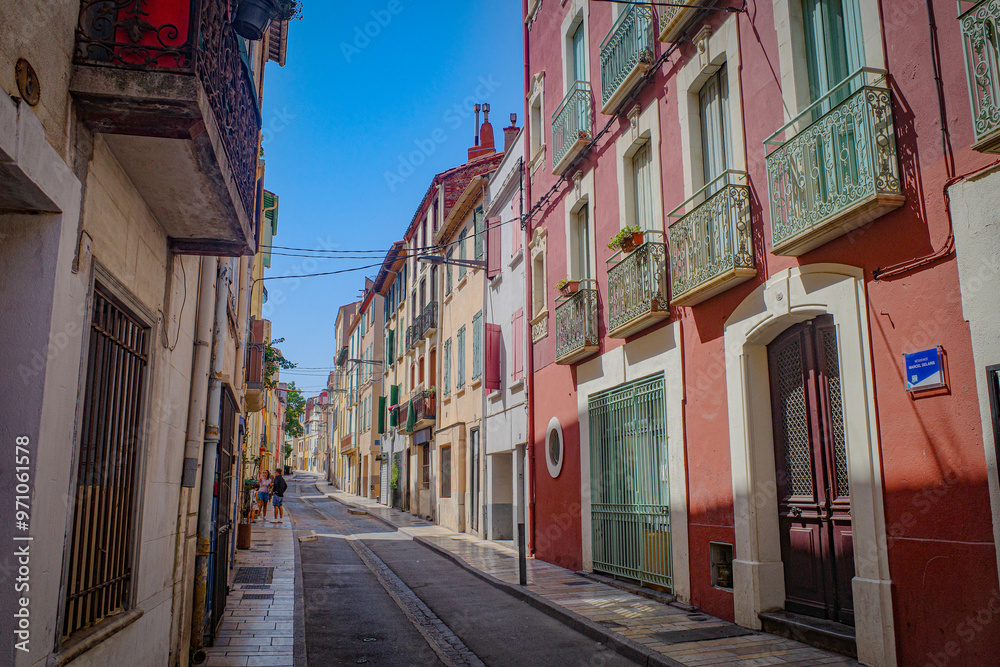 Obraz premium Perpignan, France - 27 August, 2024: Charming narrow streets in the old town of Perpignan, French Catalonia