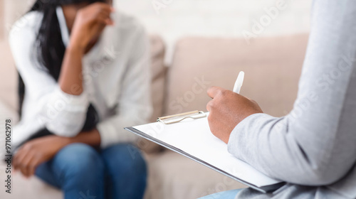 Wallpaper Mural Unrecognizable female psychologist noting problems of woman patient at therapy session,selective focus Torontodigital.ca