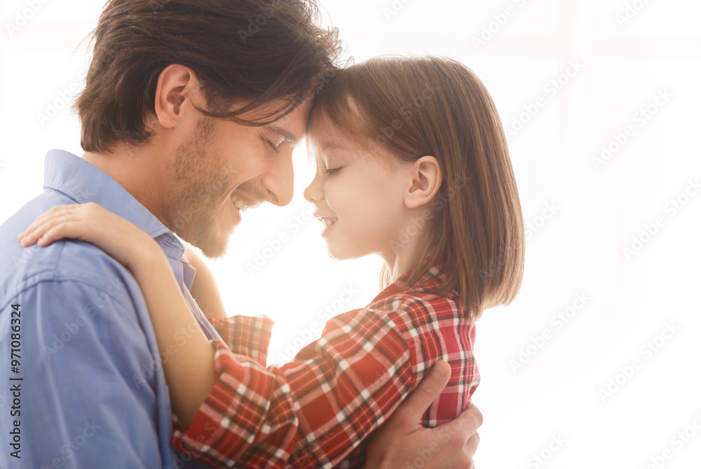 Close up of young father hugging his cute little daughter over white background, love and affectionate concept Close up of young father hugging his cute little daughter over white background, love and affectionate concept