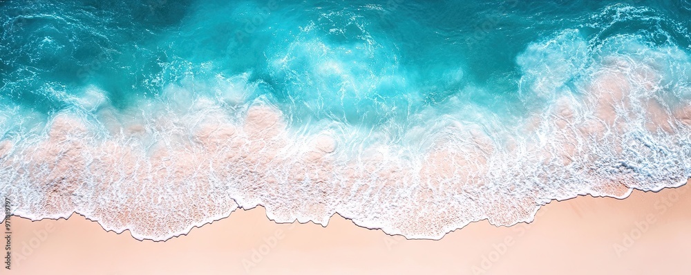 The edge of the beach, the white sand and blue water blend together in an elegant gradient. Aerial view. Background, wallpaper, banner The edge of the beach, the white sand and blue water blend together in an elegant gradient. Aerial view. Background, wallpaper, banner
