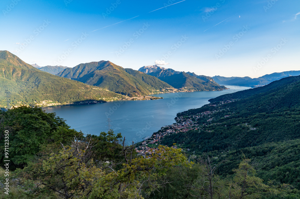View of Lake Como, towards the south, from Musso, with the overhanging mountains, Dervio, the roads and the towns bordering the lake.
View of Lake Como, towards the south, from Musso, with the overhanging mountains, Dervio, the roads and the towns bordering the lake.