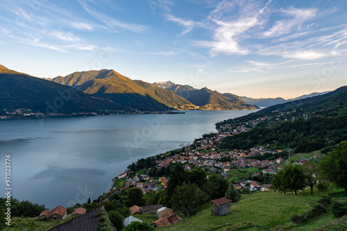 View of Lake Como, towards the south, from Musso, with the overhanging mountains, Dervio, the roads and the towns bordering the lake.
