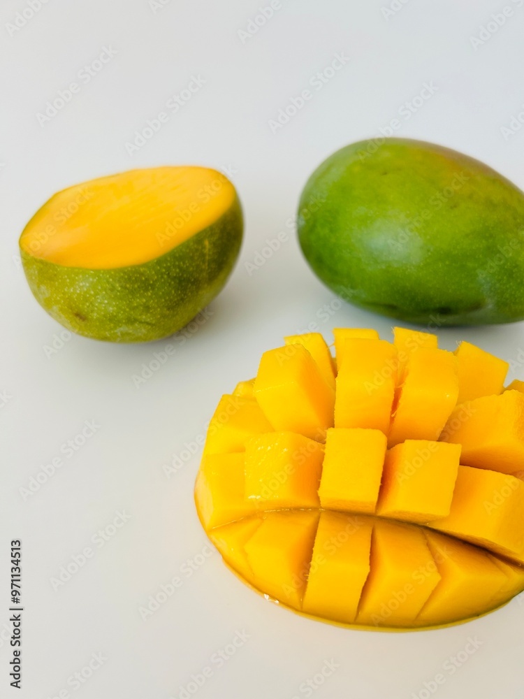 Ripe Mango Fruit Cut into Cubes Isolated on White Background Ripe Mango Fruit Cut into Cubes Isolated on White Background