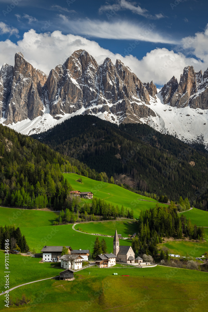 Spring views in Dolomites in Italy. In the picture Santa Maddalena di Funes with Odle mountains.