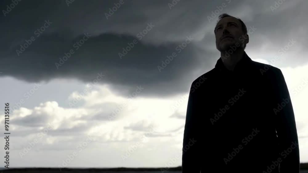 Silhouette of Man Against a Cloudy Sky Silhouette of Man Against a Cloudy Sky