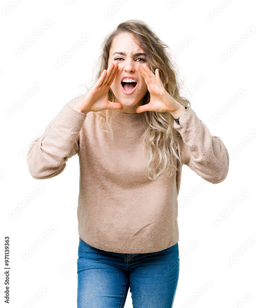 Beautiful young blonde woman wearing sweatershirt over isolated background Shouting angry out loud with hands over mouth Beautiful young blonde woman wearing sweatershirt over isolated background Shouting angry out loud with hands over mouth