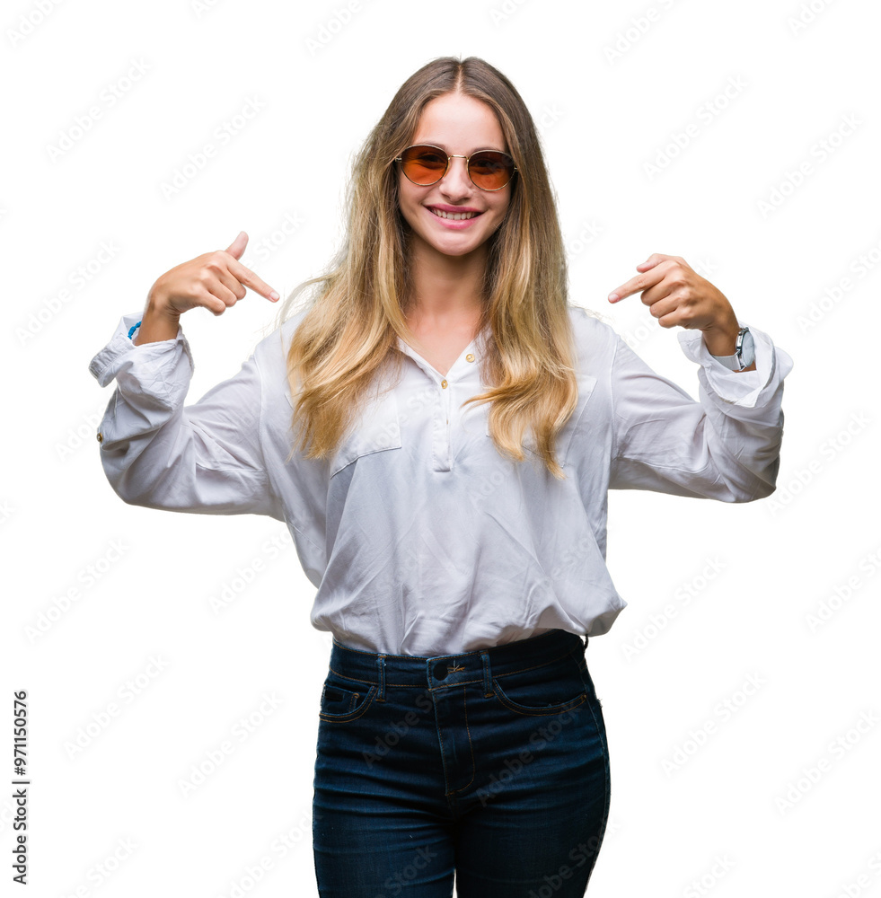 Young beautiful blonde woman wearing sunglasses over isolated background looking confident with smile on face, pointing oneself with fingers proud and happy.