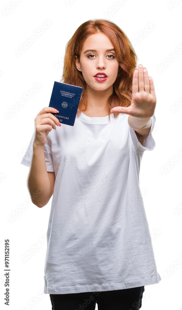 Young beautiful woman holding passport of germany over isolated background with open hand doing stop sign with serious and confident expression, defense gesture Young beautiful woman holding passport of germany over isolated background with open hand doing stop sign with serious and confident expression, defense gesture
