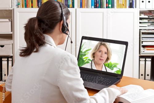 Telemedicine concept: two doctors or pharmacists during a medical video conference about examination results. photo